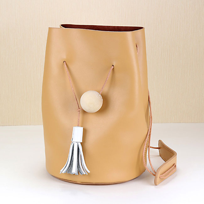 Minimal Leather Bucket Bag with Tassel Detailing 